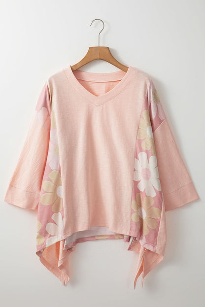 Floral V-neck blouse with three-quarter sleeves and high-low hem