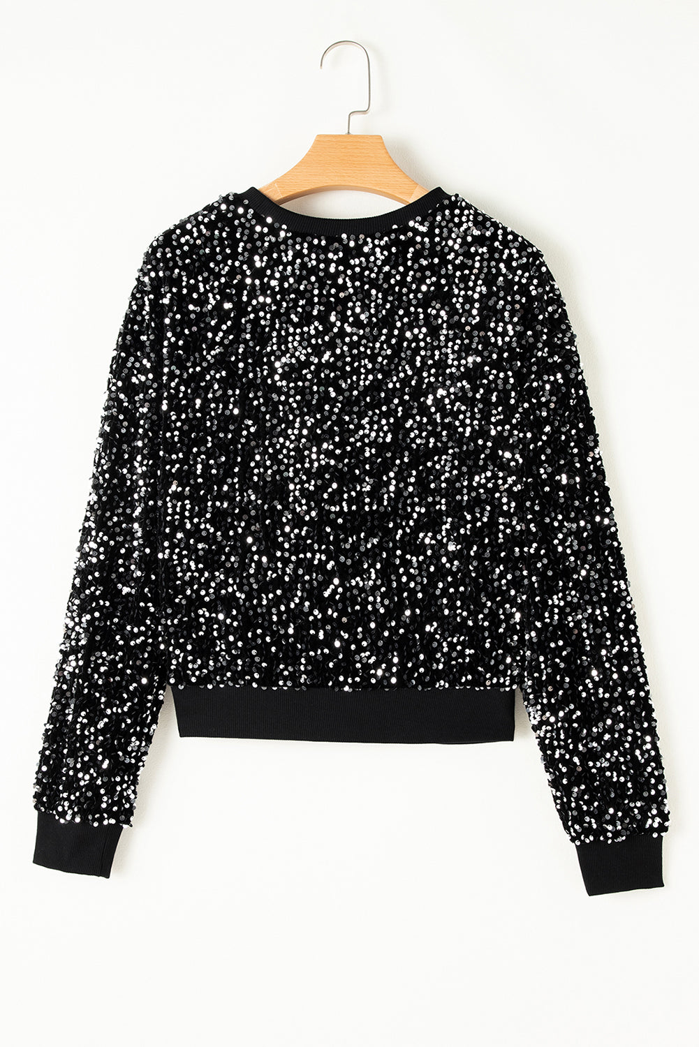 Glamorous black sequined cropped blouse with long sleeves