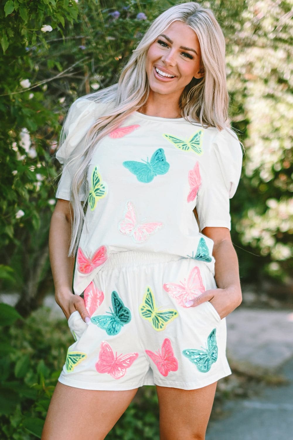 Charming butterfly print top and shorts set with pockets, featuring a comfortable cotton blend.