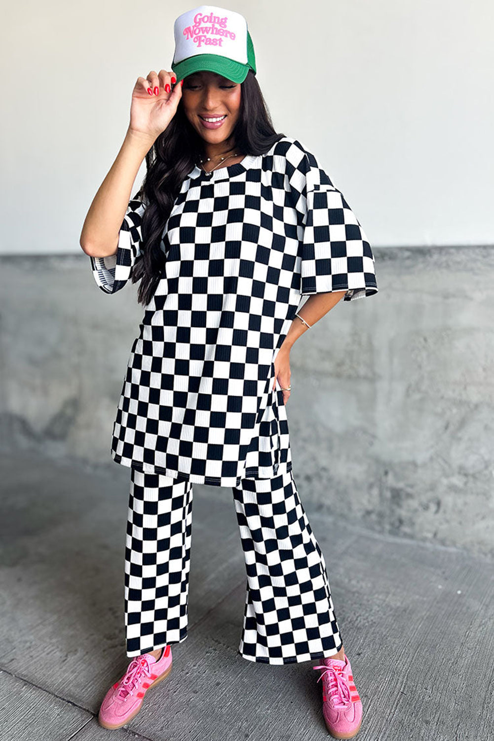 Chic black checkered tunic top and flared pant ensemble