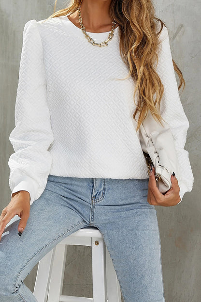 Chic white textured puff sleeve top with round neckline