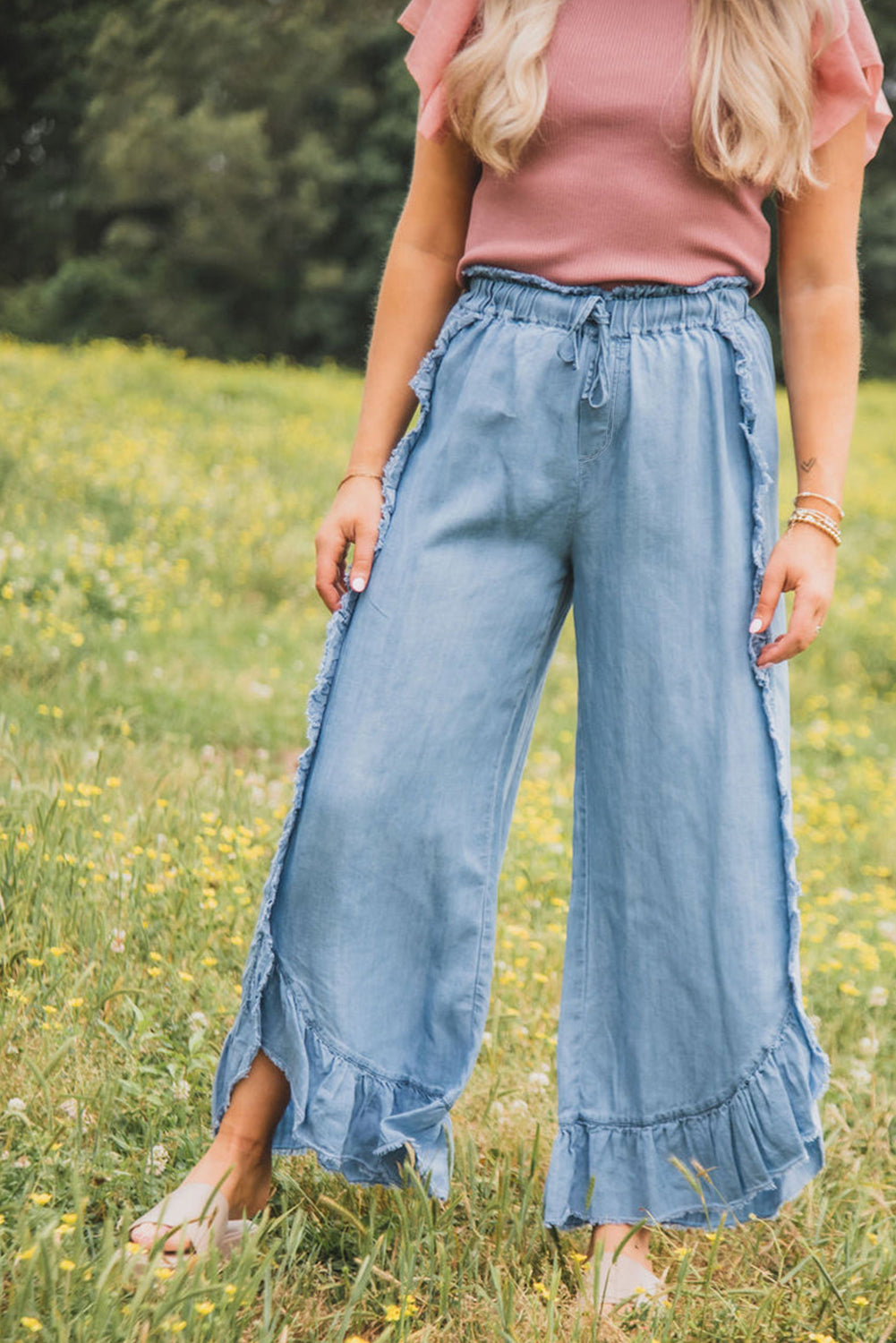 Myosotis light wash ruffled wide leg jeans with raw hem detail