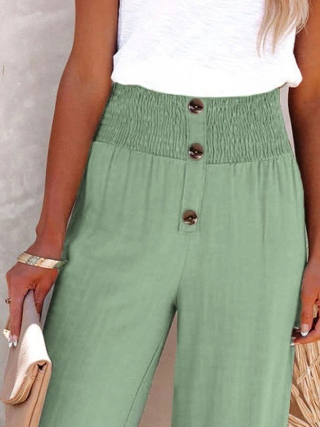 Chic high-waisted pants with decorative buttons