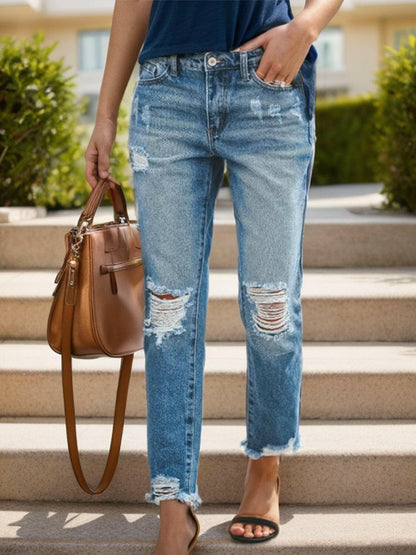 Distressed Raw Hem Jeans with Pockets.