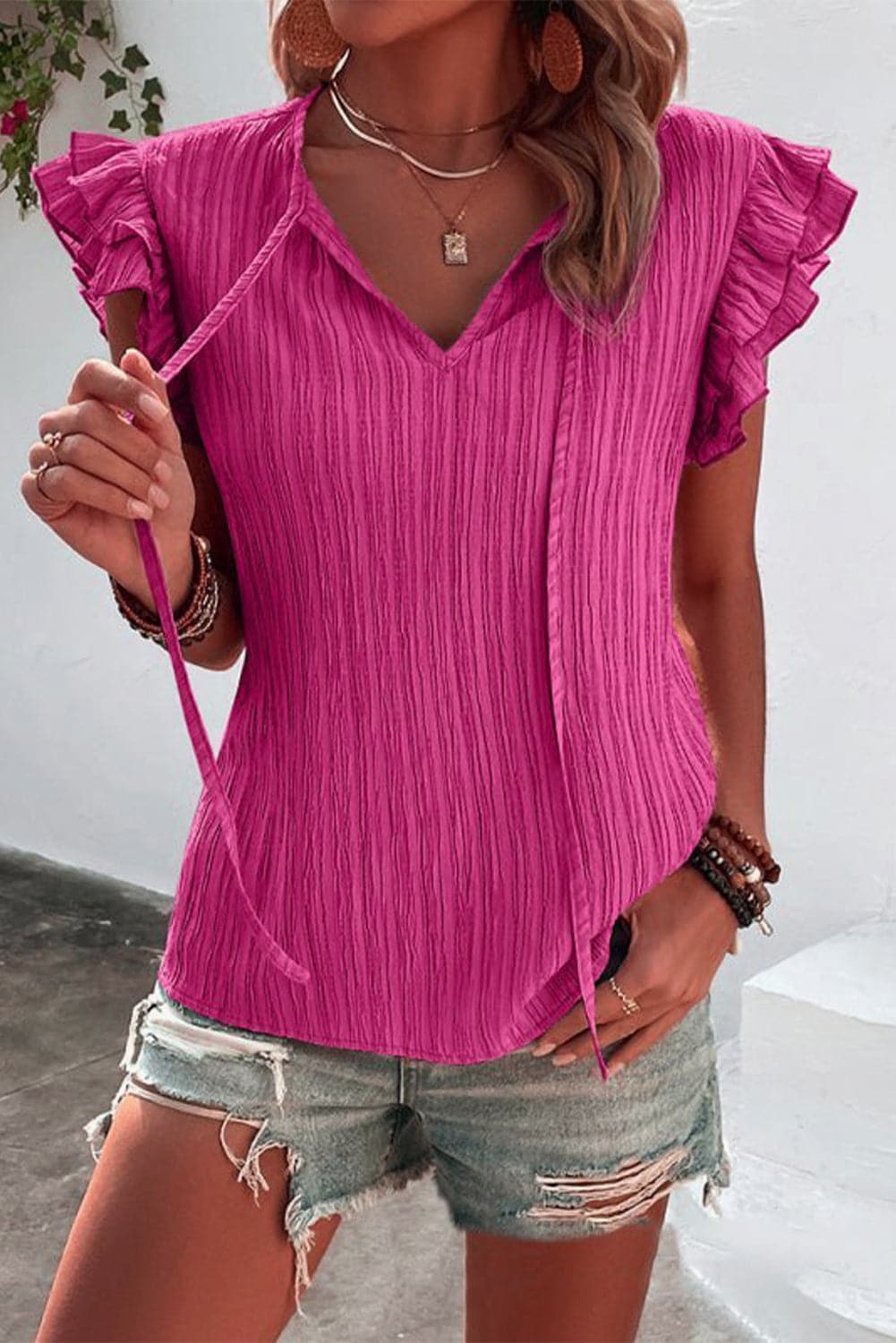 Ruffled Tie Neck Cap Sleeve Blouse.