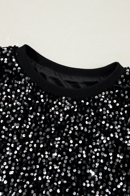 Glamorous black sequined cropped blouse with long sleeves