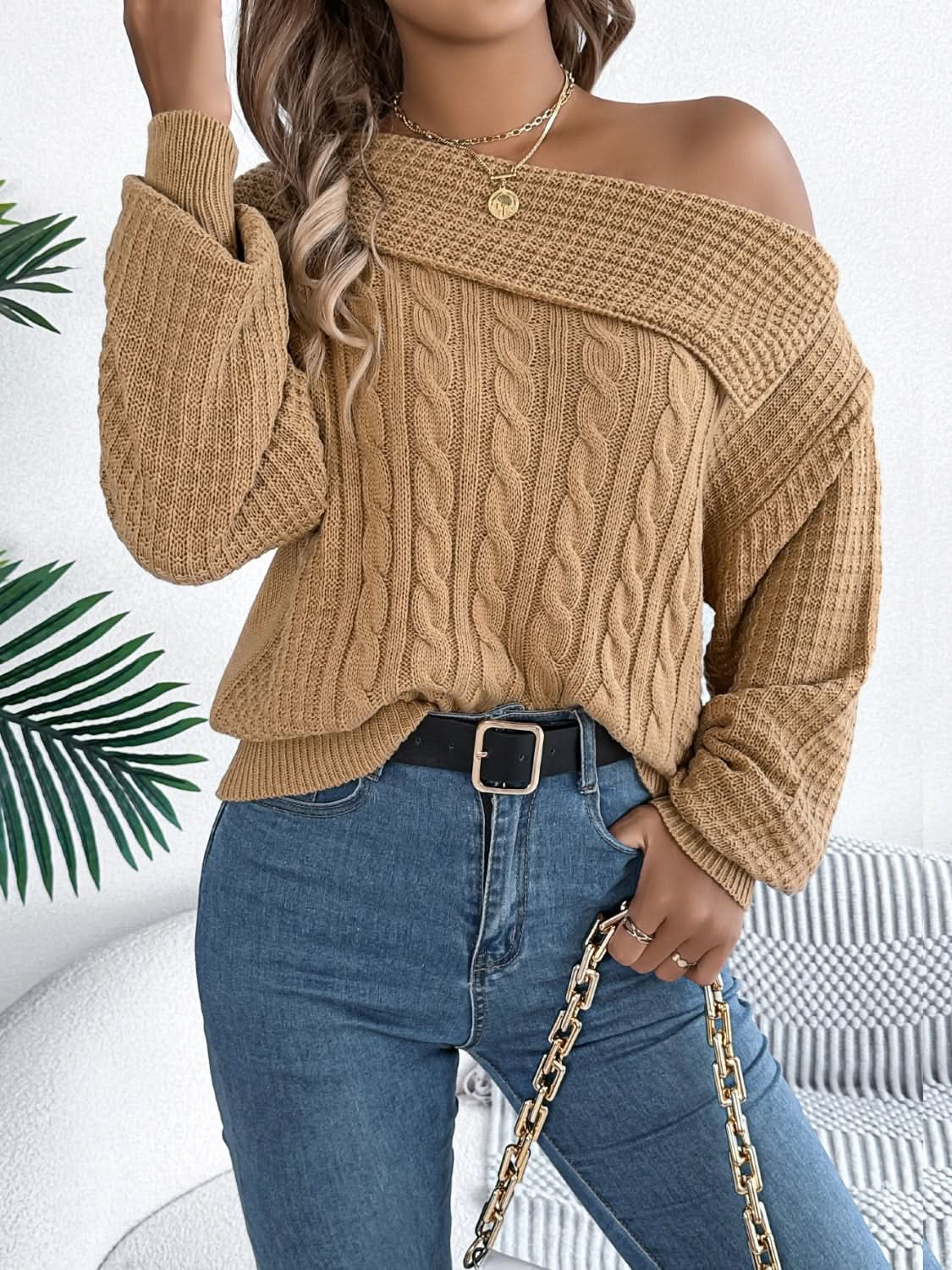 Asymmetrical cable-knit long sleeve sweater