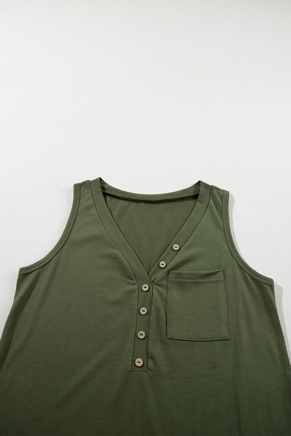 Jungle green v-neck tank top with button detail and patched pocket