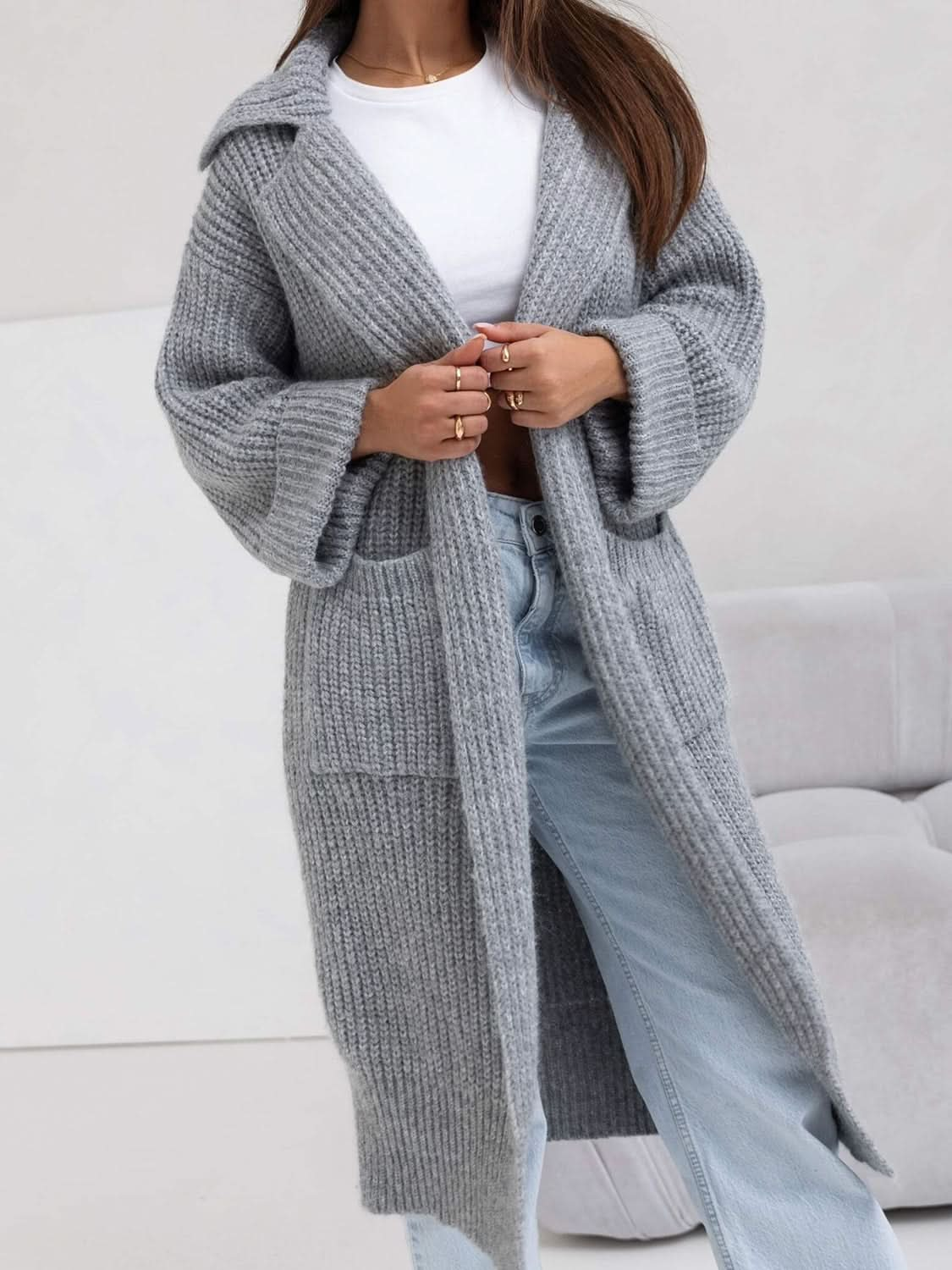 Pocketed collared neck dropped shoulder cardigan in gray, featuring moderate stretch and large front pockets.