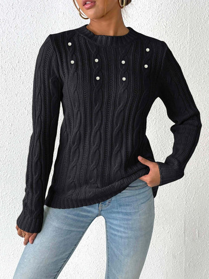 Cozy cable-knit long sleeve sweater with round neckline