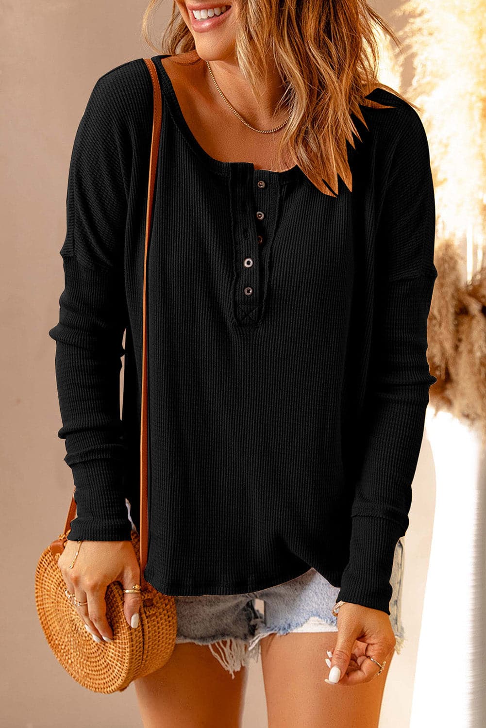 Chic drop shoulder half-button tee