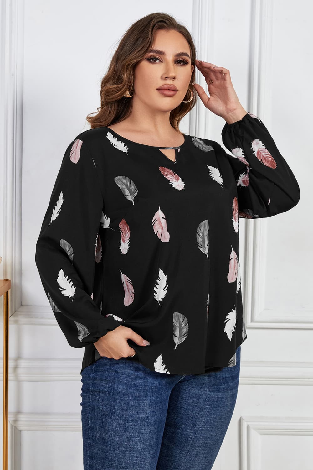 Melo Apparel Plus Size Printed Round Neck Long Sleeve Cutout Blouse.