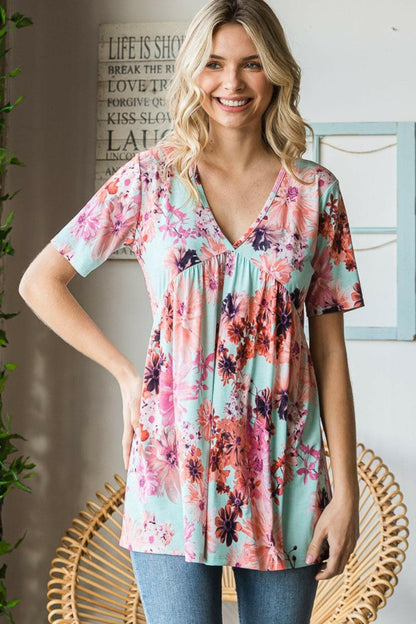 Heimish Full Size Floral V-Neck Short Sleeve Babydoll Blouse.