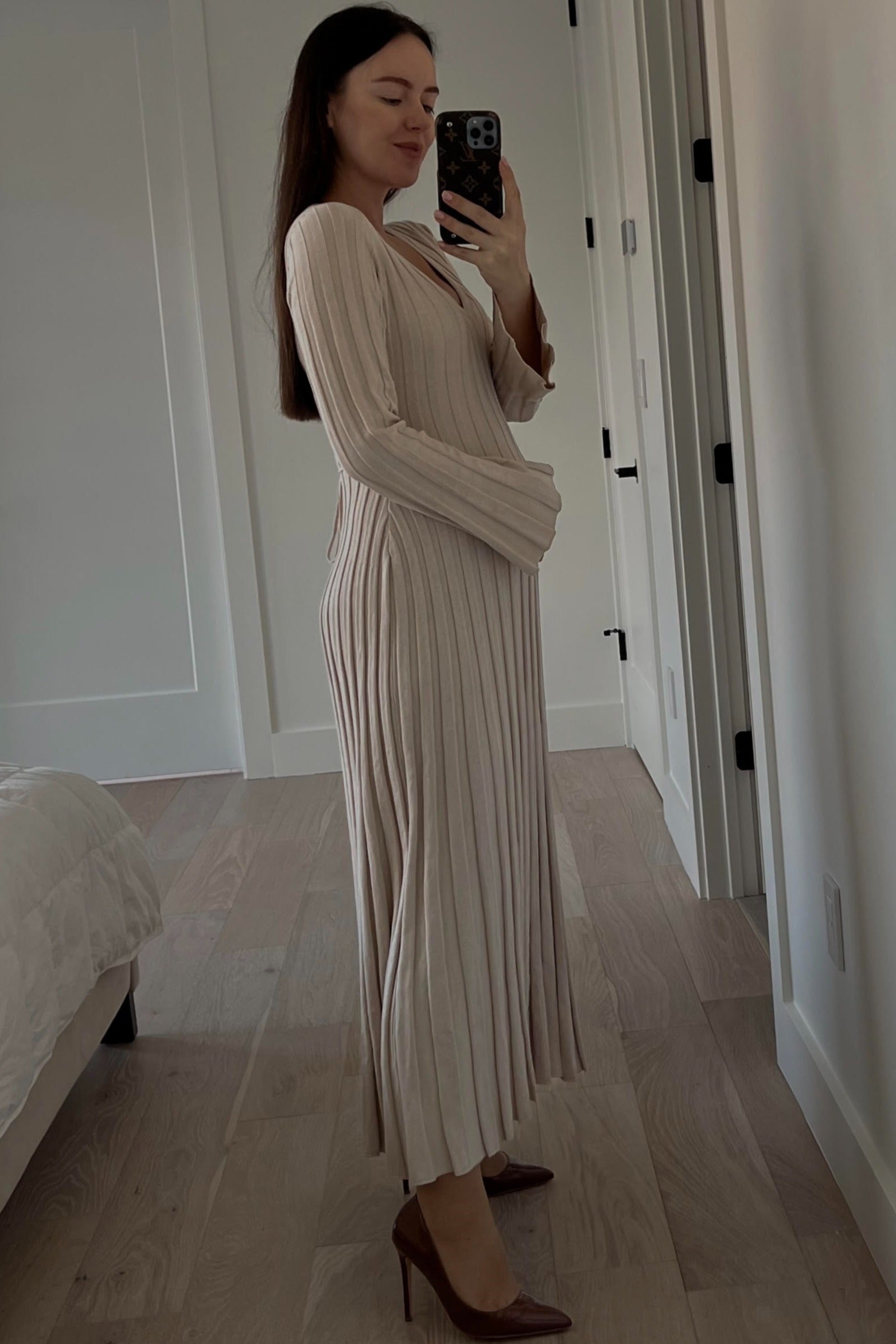 Side profile of the PinkBlush Taupe Ribbed Maternity Knit Maxi Dress, showing the comfortable stretch of the knit fabric.