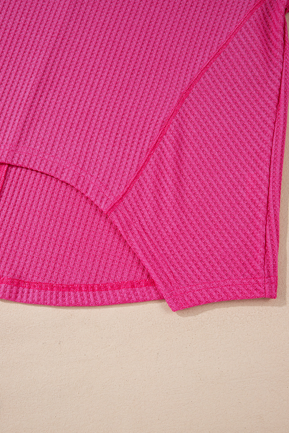 Chic bright pink waffle knit V-neck blouse with drop shoulders