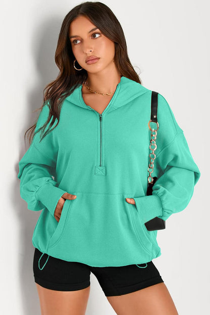 Sheer pocketed half zip hoodie for a stylish look