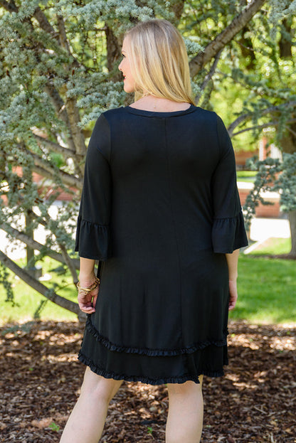 Chic black plus size ruffled sleeve dress for effortless elegance