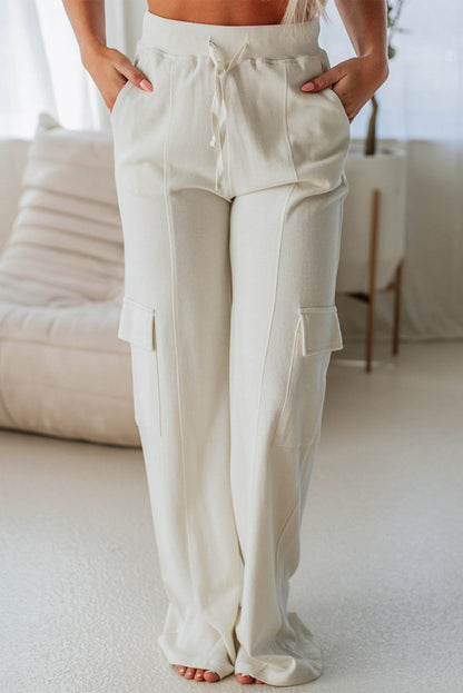 Beige high-waisted cargo sweatpants with pockets for casual comfort