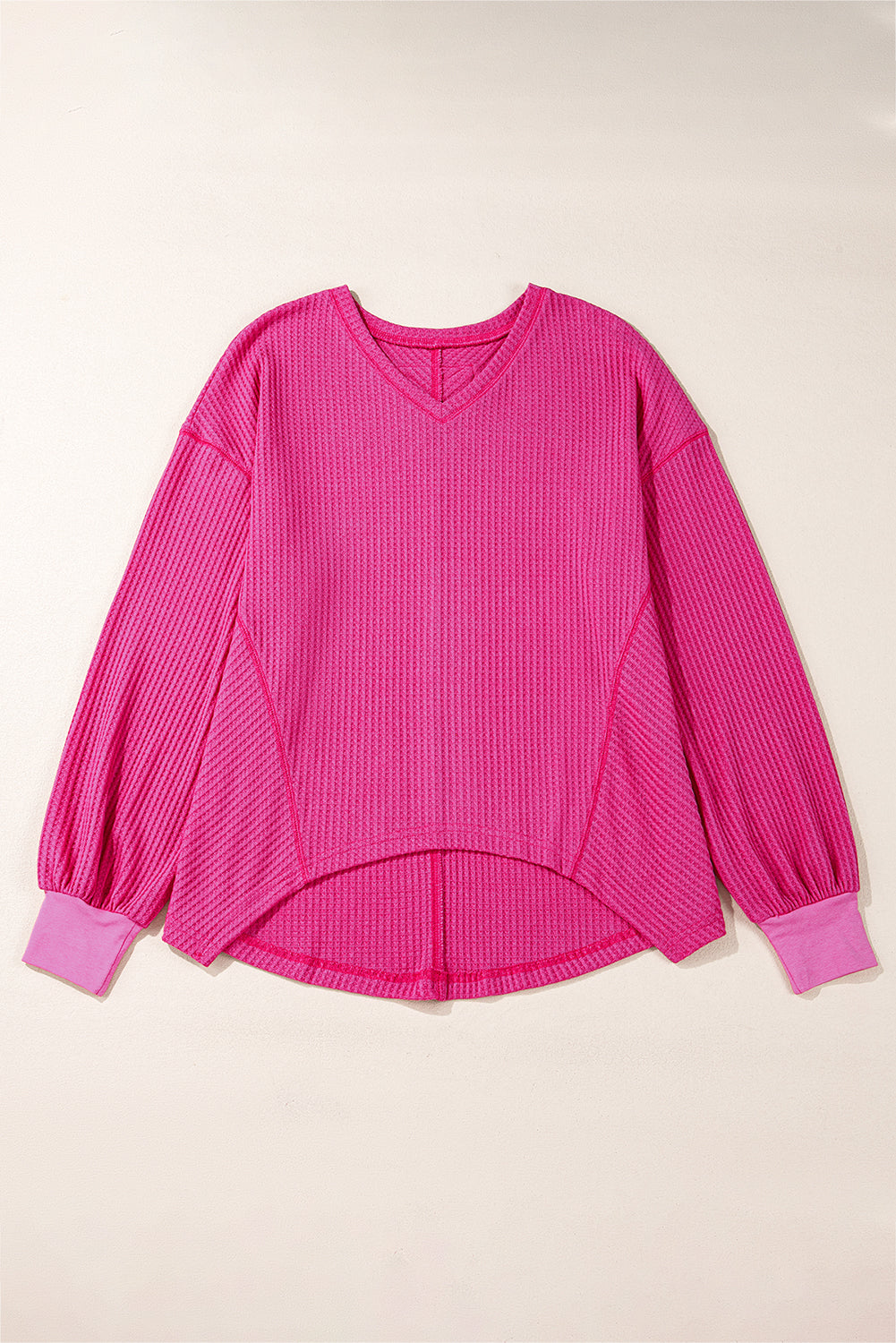 Chic bright pink waffle knit V-neck blouse with drop shoulders