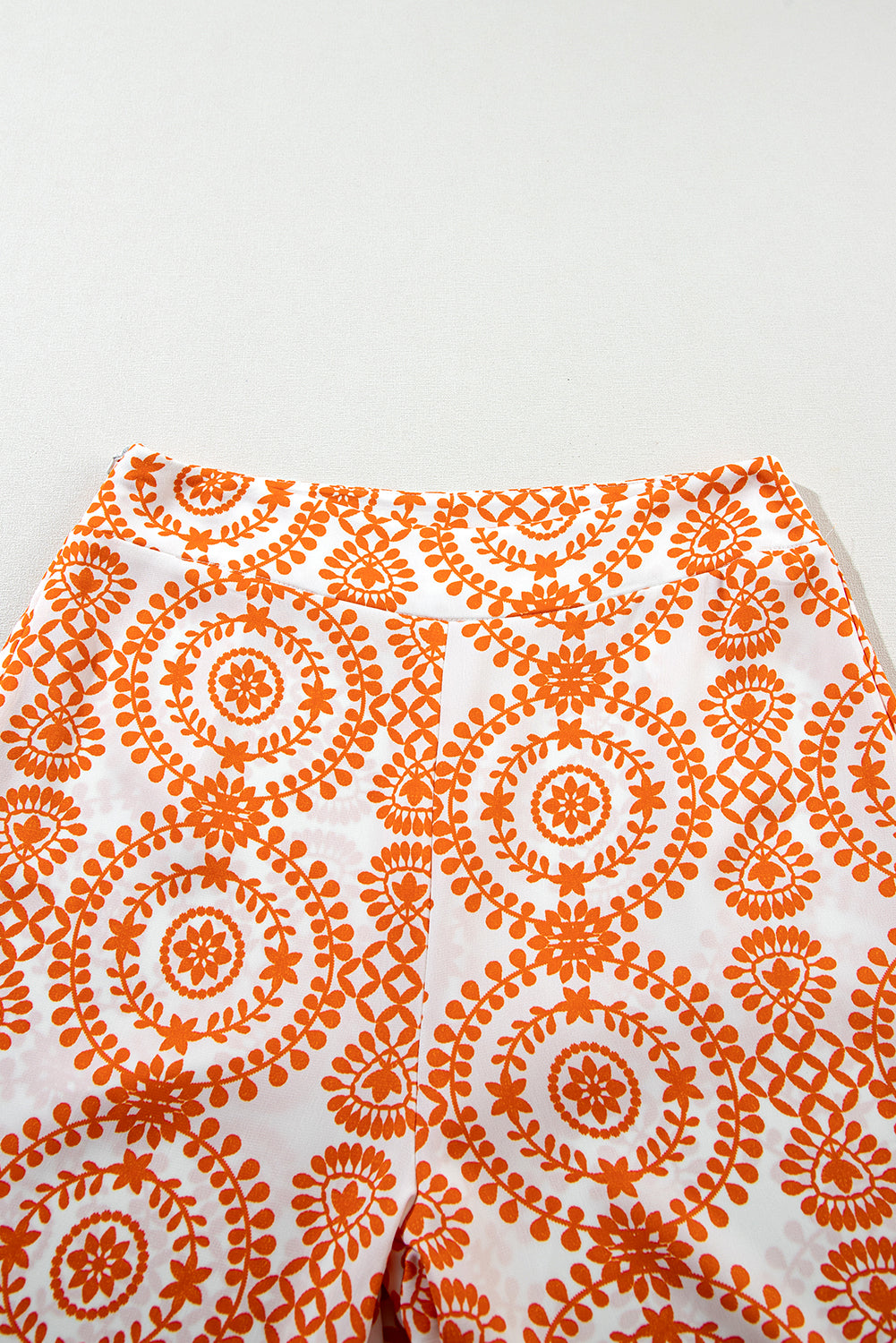 Chic orange bohemian wide leg pants with retro floral design