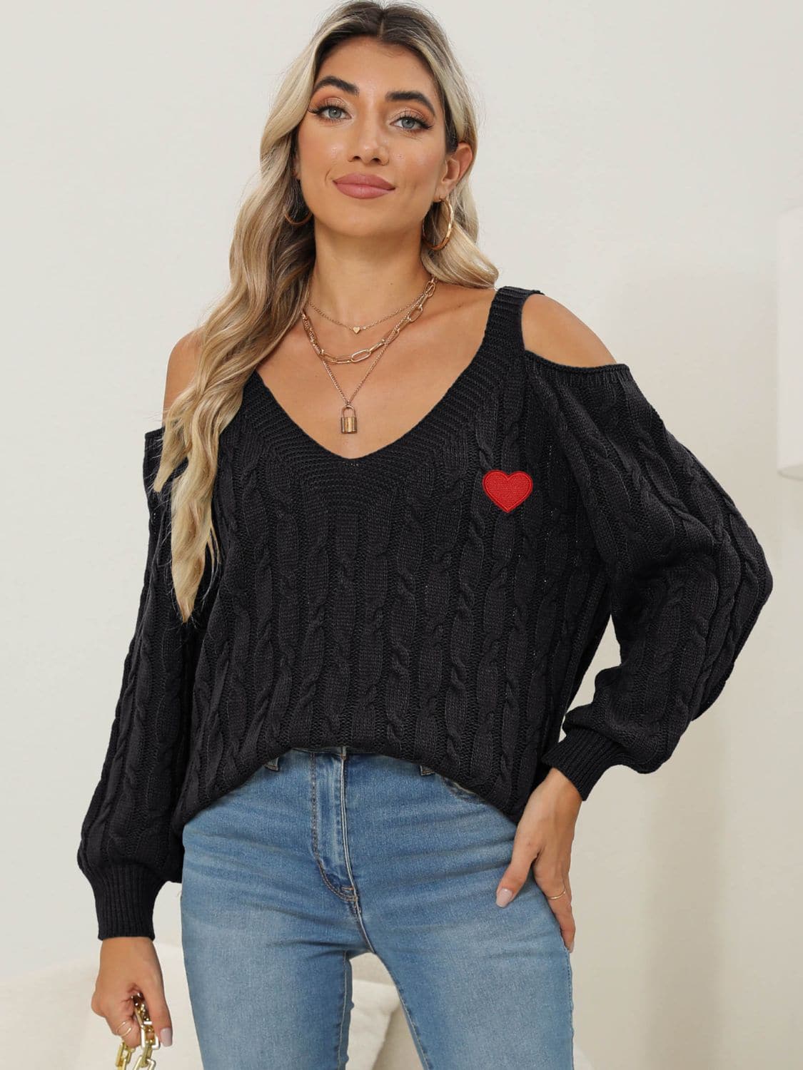 Cozy cable-knit heart v-neck sweater