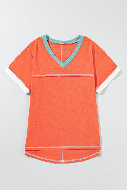 Grapefruit orange exposed seam V-neck tee with contrast trim