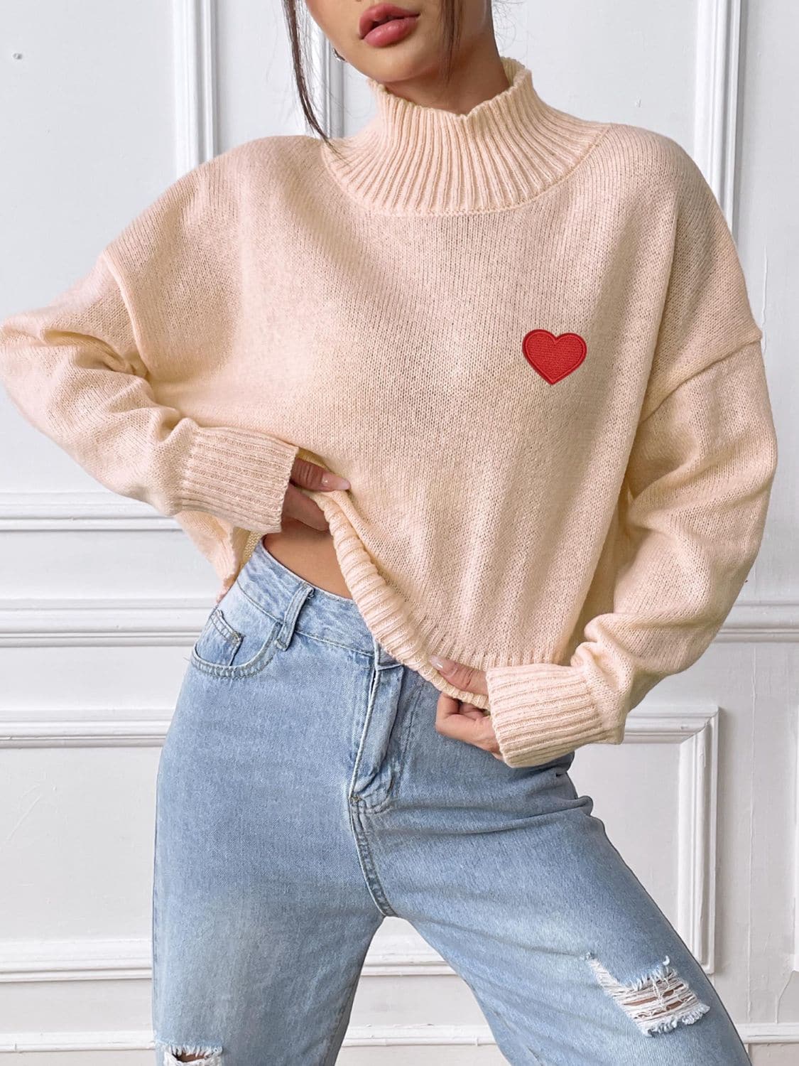 Charming heart turtleneck sweater for cozy elegance