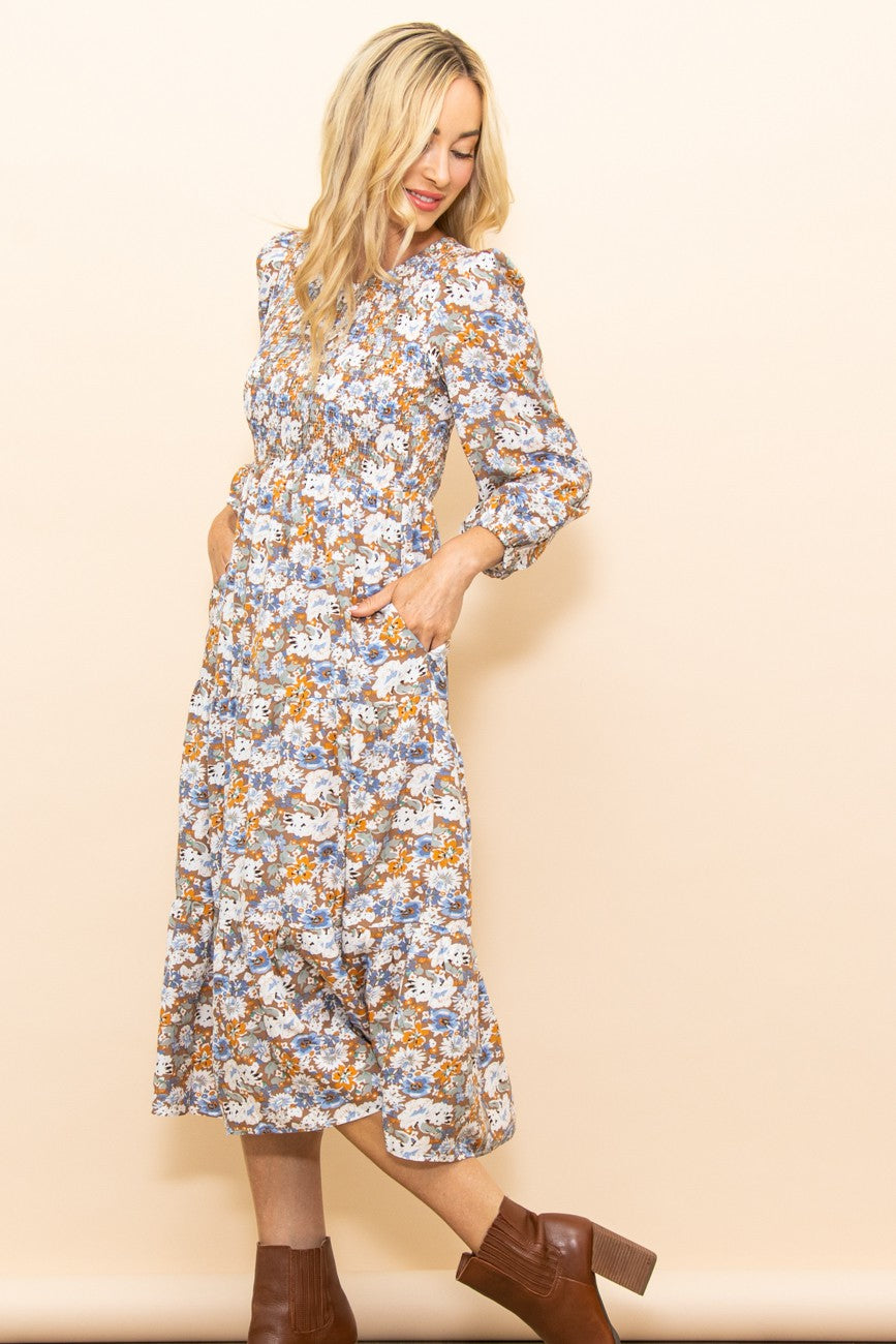 Close-up of the PinkBlush Taupe Floral Smocked Tiered Midi Dress, highlighting the intricate smocked bodice and elegant flora