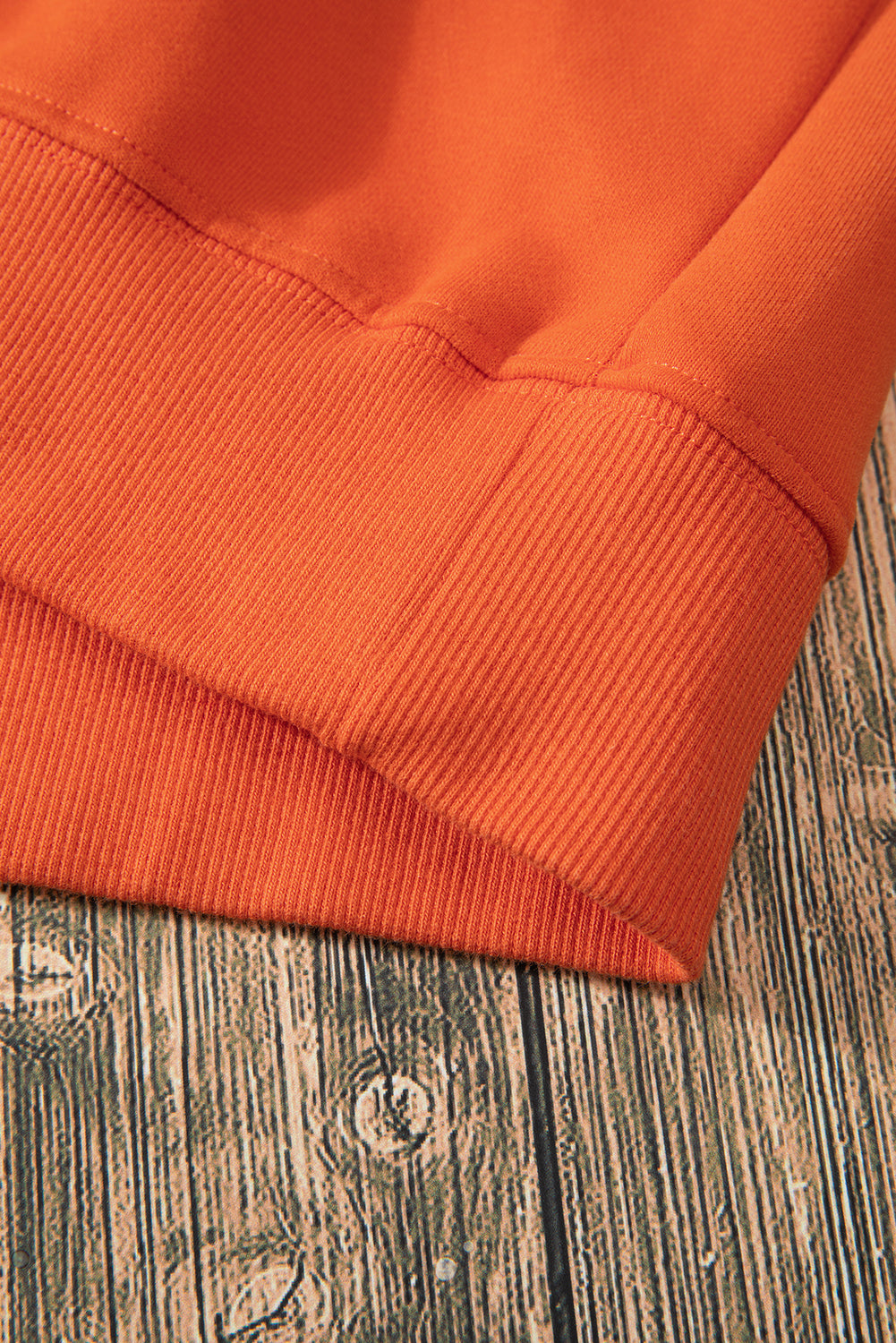 Cozy russet orange fleece-lined sweatshirt with drop shoulders