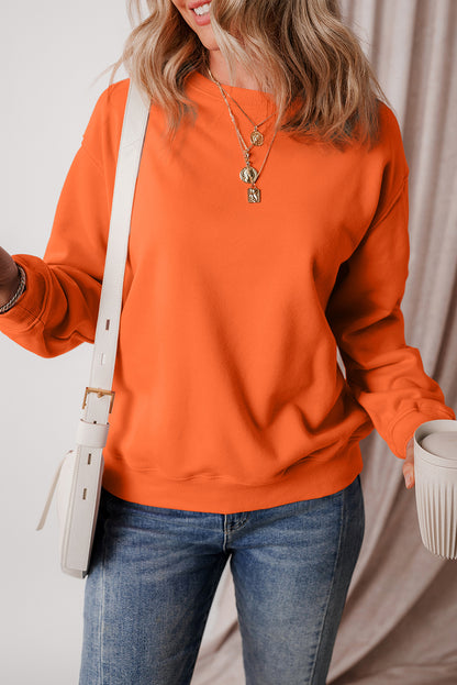 Cozy russet orange fleece-lined sweatshirt with drop shoulders