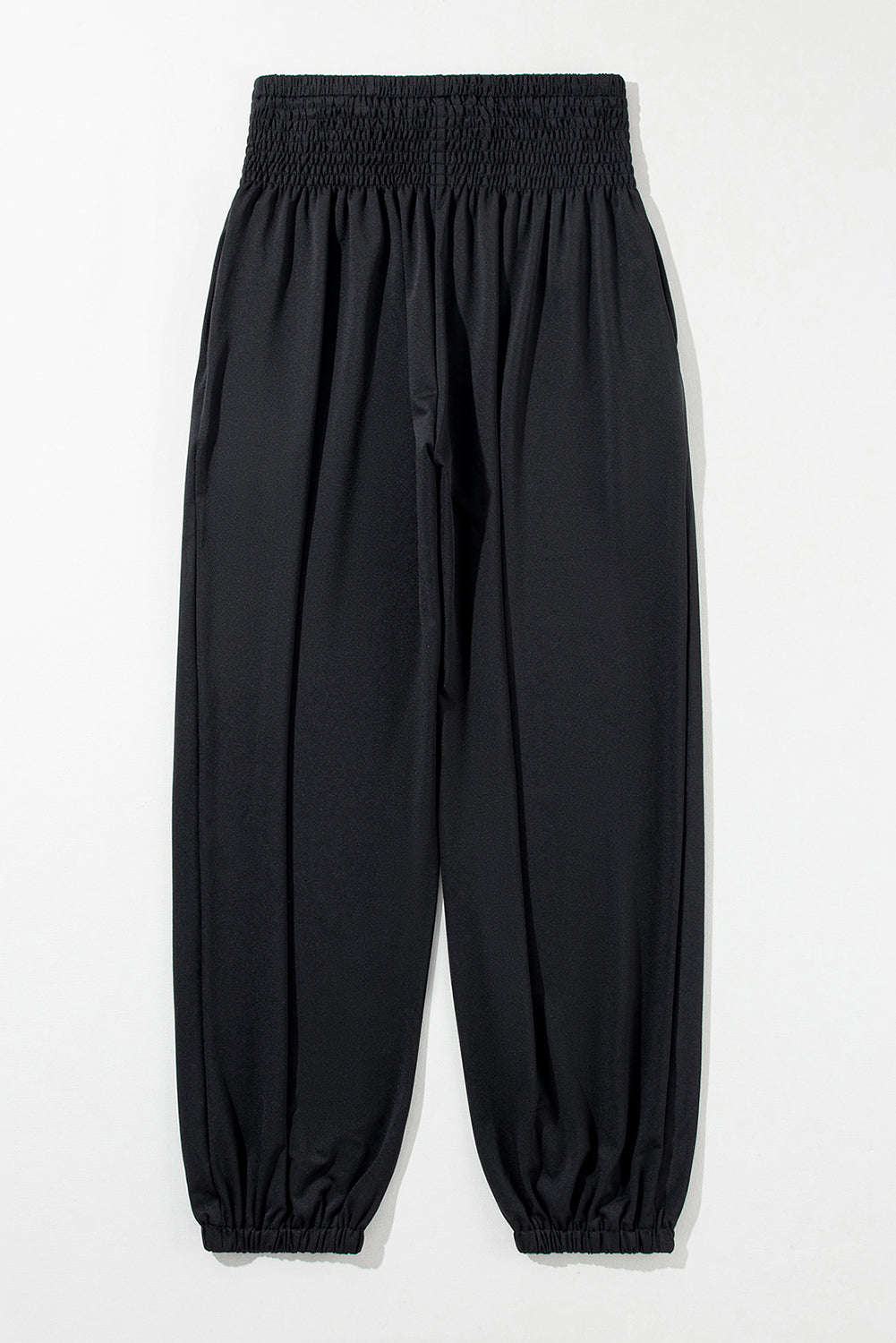 Chic black smocked high-rise joggers for a trendy look