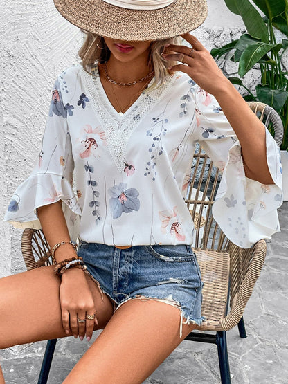 Ruffled Printed V-Neck Half Sleeve Blouse.