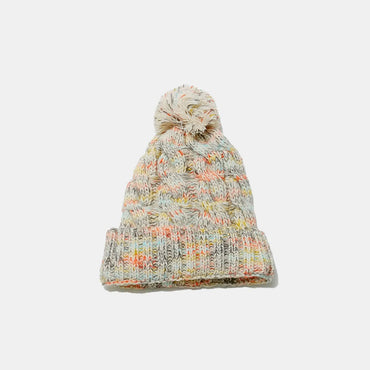 Cozy cable-knit beanie with playful pompom