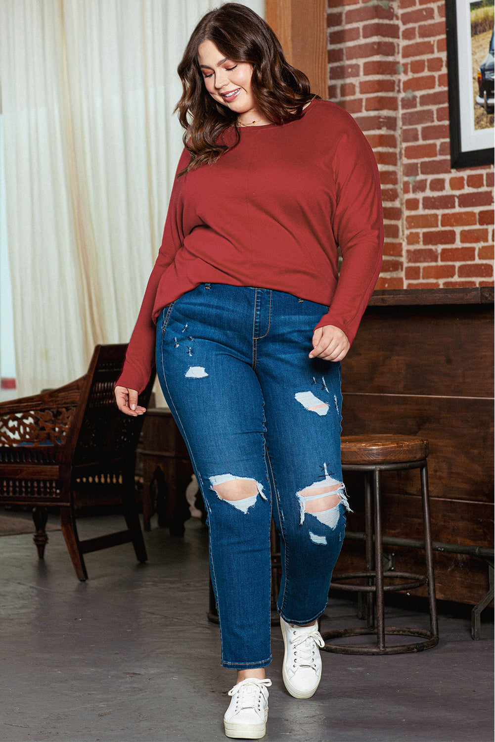 Sophisticated red dahlia long sleeve top with piping detail for plus sizes