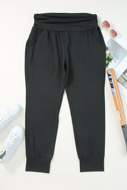 Stylish black high-waisted plus-size skinny trousers with pockets