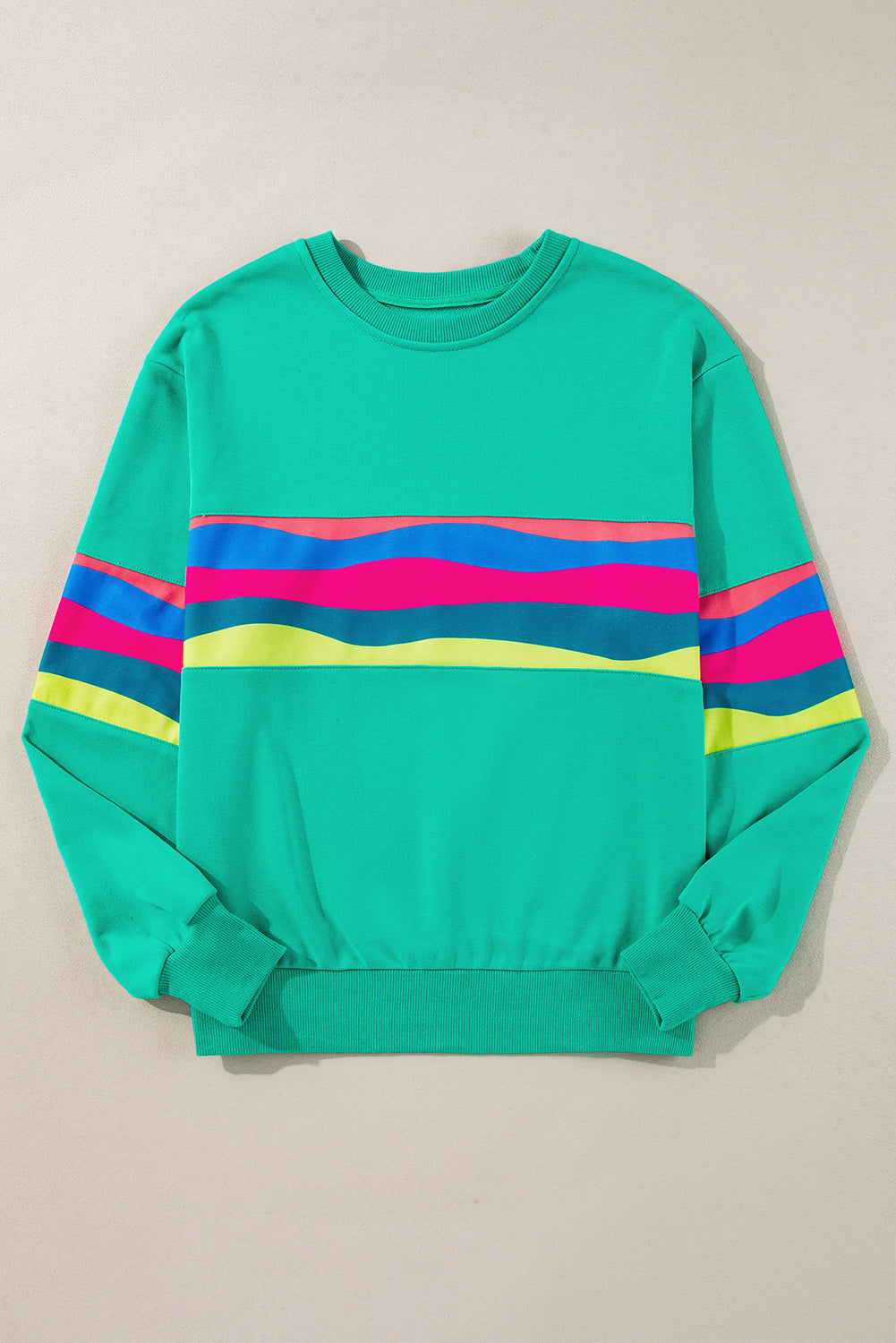 Vibrant green striped long sleeve tee for effortless style