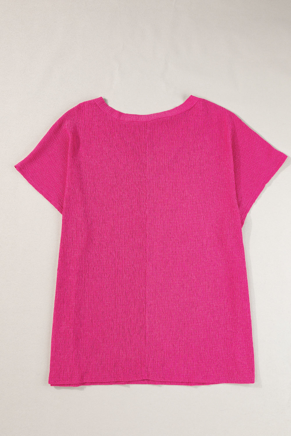 Vibrant pink textured bubble hem top for plus sizes