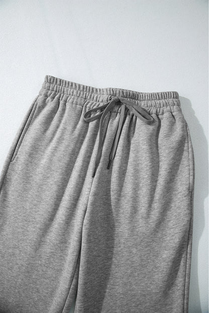 Cozy light grey fleece-lined casual pants with adjustable drawstring waist