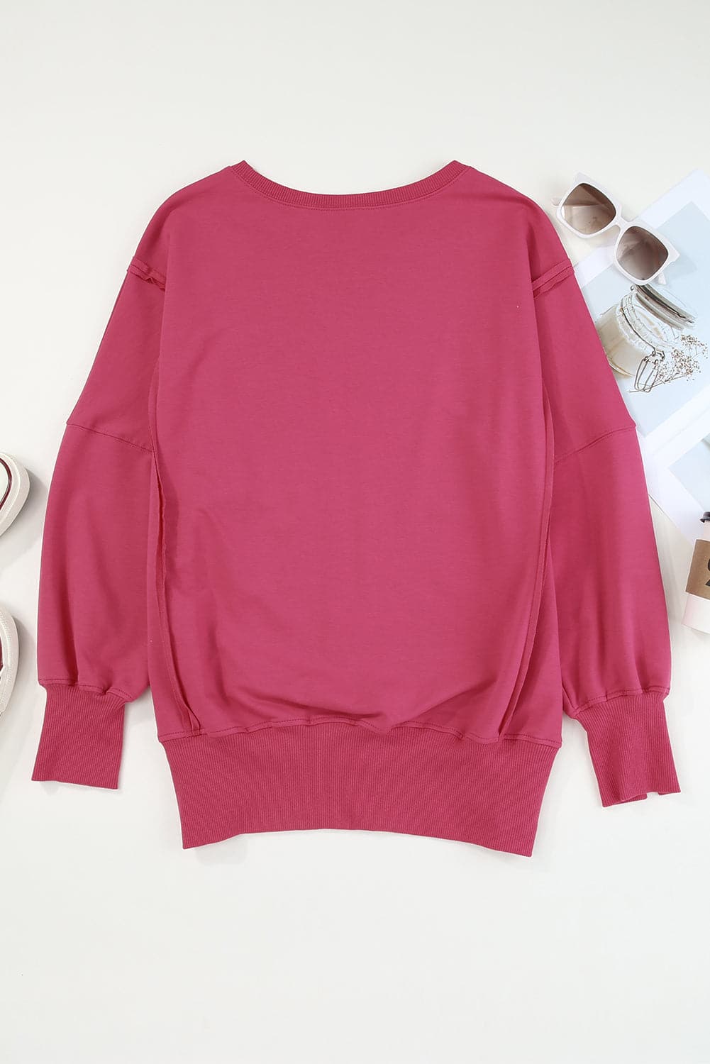 Slit Exposed Seam Round Neck Sweatshirt.