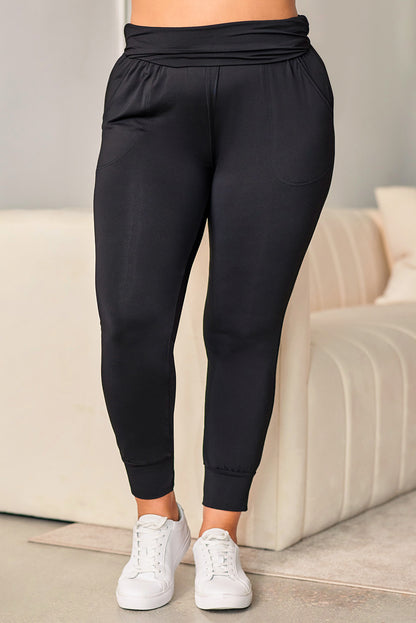 Stylish black high-waisted plus-size skinny trousers with pockets