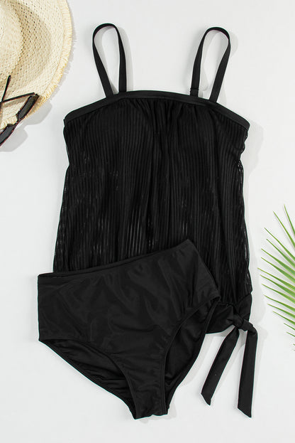 Striking black striped tankini with a chic knotted hem