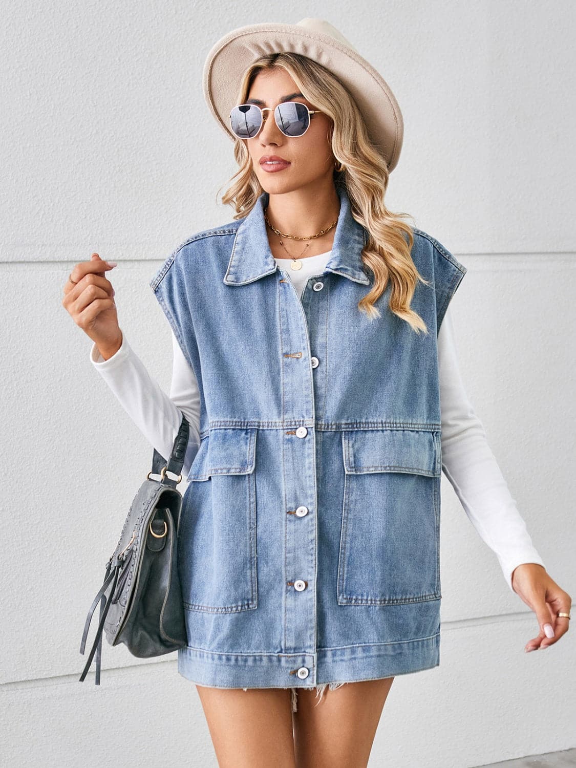 Pocketed Button Up Sleeveless Denim Jacket.