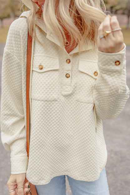 Chic apricot hoodie with buttoned neckline and functional pockets