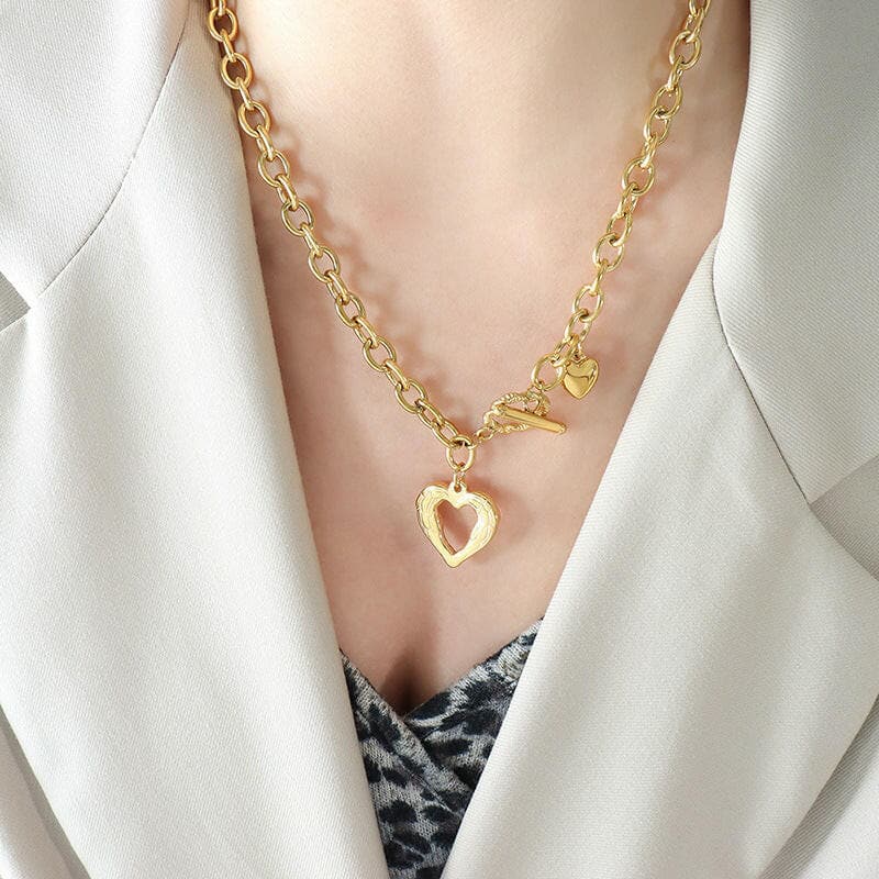 Titanium steel heart pendant necklace in gold plating, elegant and stylish design.