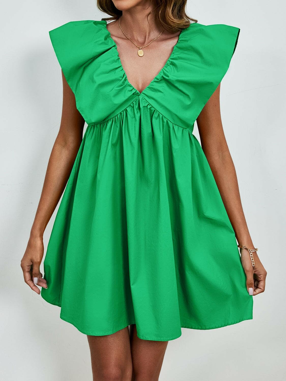 V-Neck Cap Sleeve Mini DressUpgrade Your Style with Our V-Neck Cap Sleeve Mini Dress
 Step out in confidence and elegance with our V-Neck Cap Sleeve Mini Dress, a versatile piece that effortlesLove Salve -Neck Cap Sleeve Mini Dress