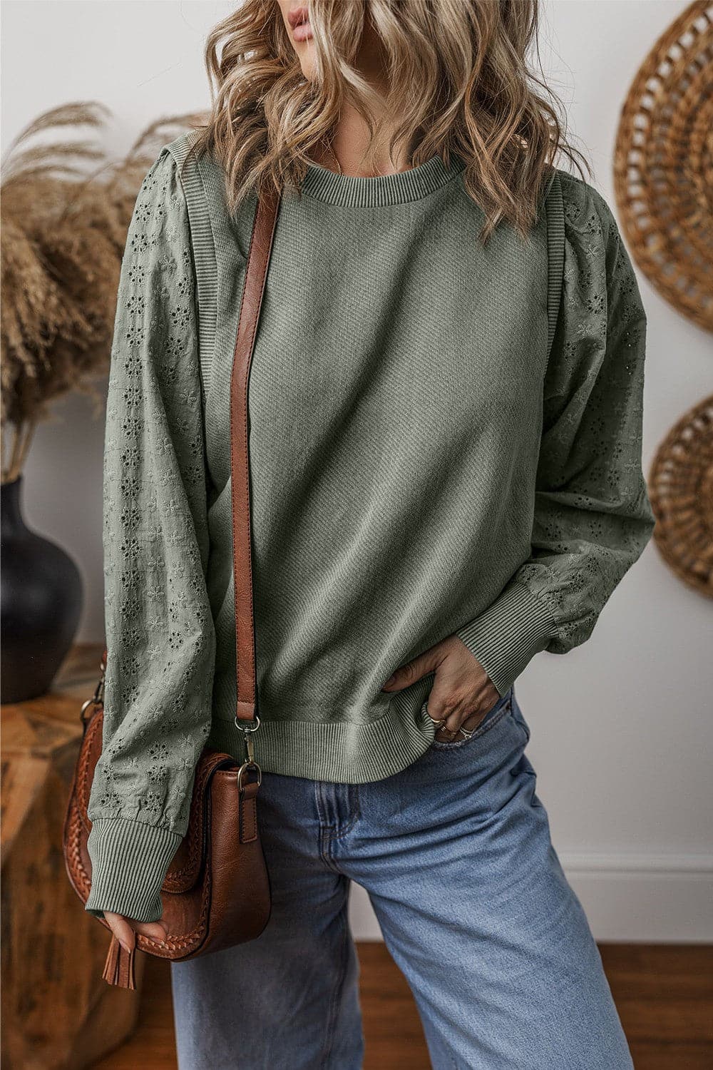 Eyelet Round Neck Long Sleeve Sweatshirt.