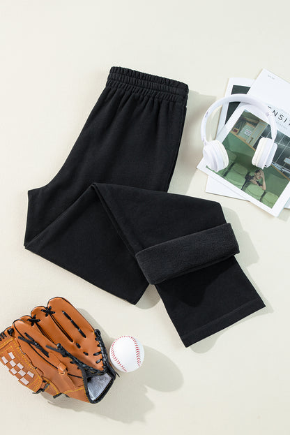 Cozy black fleece-lined casual pants with adjustable drawstring waist