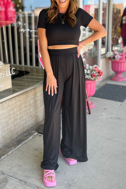 Chic black crop top and wide leg pants ensemble