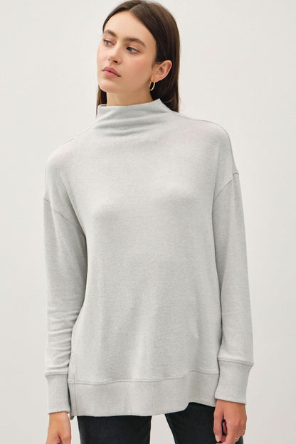 Cool Side Slit Mock Neck Long Sleeve Tunic Top in gray worn by a model.