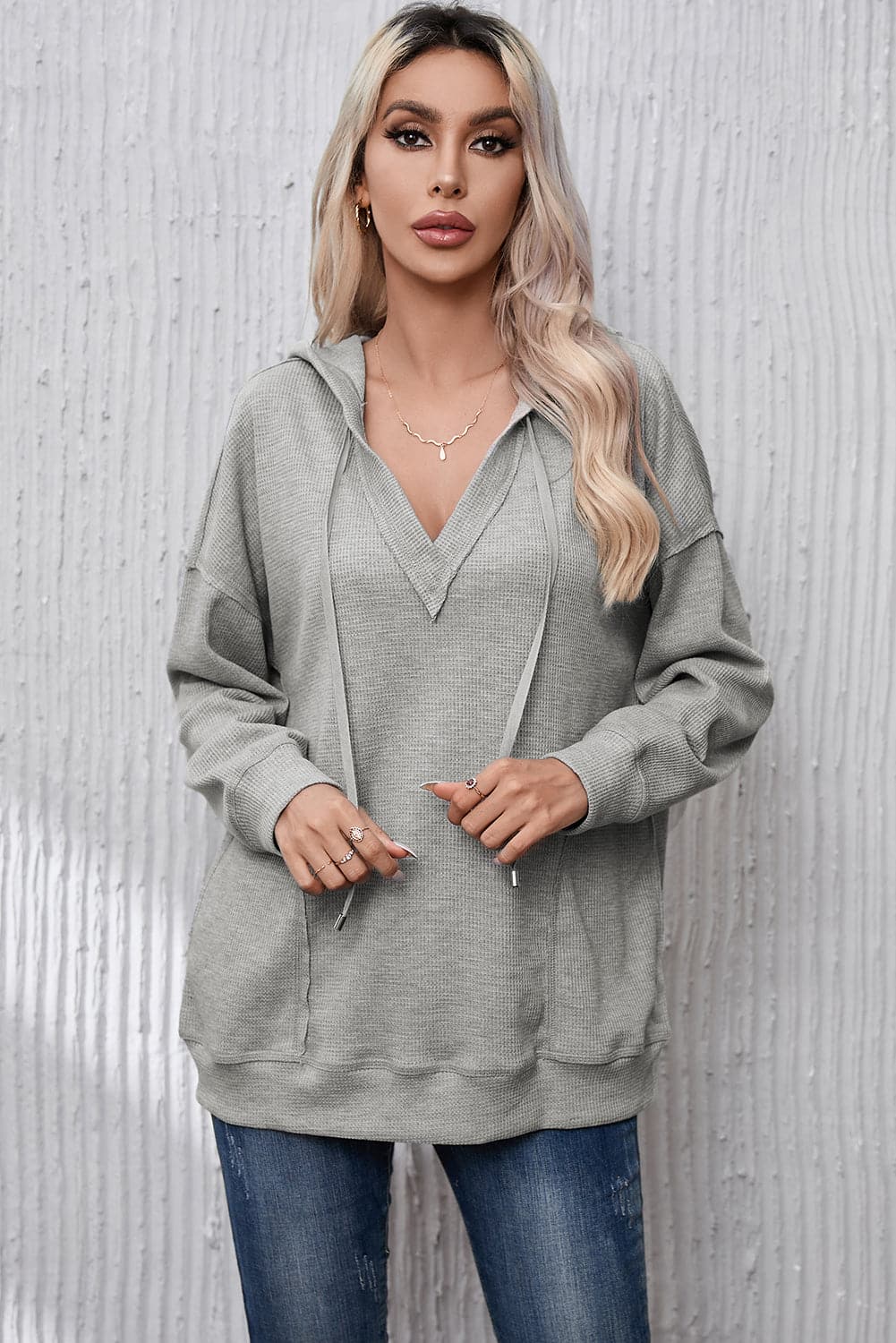 Drawstring Pocketed Dropped Shoulder Hoodie.